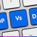 Teclas de computador com as palavras “CDP vs DMP”, representando a comparação entre plataformas de dados de clientes e de gerenciamento de audiência.